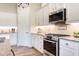 Modern kitchen with stainless steel appliances and granite countertops at 6916 E Quince St, Mesa, AZ 85207