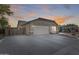 Two-car garage with a long driveway and gated entry at 10763 W Deanna Dr, Sun City, AZ 85373