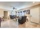 Living room features tiled floors, a sofa, and two armchairs at 12420 W Wildwood Dr, Sun City West, AZ 85375