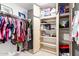 Large walk-in closet with shelves and hanging rods at 15506 S 180Th Ln, Goodyear, AZ 85338