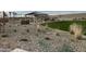 Relaxing community BBQ area with tables and a grassy lawn at 16068 W Questa Dr, Surprise, AZ 85387