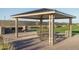 Community grilling station with multiple grills and picnic tables at 16068 W Questa Dr, Surprise, AZ 85387