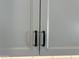 Close-up of kitchen cabinets with matte black hardware at 16068 W Questa Dr, Surprise, AZ 85387