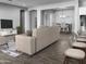 Open concept living and dining space with a neutral color scheme and modern furnishings at 16068 W Questa Dr, Surprise, AZ 85387