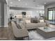 Open living room with a comfortable sofa and access to the kitchen at 16068 W Questa Dr, Surprise, AZ 85387