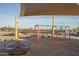 playground with swings and other play equipment at 16068 W Questa Dr, Surprise, AZ 85387