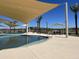 Inviting pool area with plenty of seating and shade at 16068 W Questa Dr, Surprise, AZ 85387