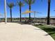 Relaxing pool area with lounge chairs and shade structures at 16068 W Questa Dr, Surprise, AZ 85387