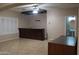 Home bar with dark wood cabinets and tile flooring at 1807 S 234Th Ln, Buckeye, AZ 85326