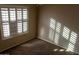 Bedroom with neutral walls, carpet flooring and window at 1807 S 234Th Ln, Buckeye, AZ 85326