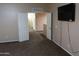 Home hallway with doors to other rooms and carpet flooring at 1807 S 234Th Ln, Buckeye, AZ 85326