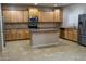 Spacious kitchen with an island and stainless steel appliances at 1807 S 234Th Ln, Buckeye, AZ 85326