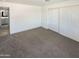 Spacious bedroom with carpet, large closet and en-suite bathroom at 1836 N 66Th Dr, Phoenix, AZ 85035