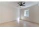 Spacious bedroom featuring a ceiling fan and window at 201 E 9Th St, Casa Grande, AZ 85122