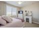 Bright bedroom with a plush bed and white dresser at 25410 S 224Th Pl, Queen Creek, AZ 85142