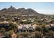 Aerial view of a luxury home with mountain views and a large backyard at 27939 N 100Th Pl, Scottsdale, AZ 85262
