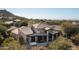 Aerial view of luxury home showcasing backyard patio and spa at 27939 N 100Th Pl, Scottsdale, AZ 85262