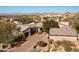 Luxury home with a large driveway and desert landscaping at 27939 N 100Th Pl, Scottsdale, AZ 85262