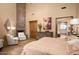 Primary suite with hardwood floors and views of the backyard at 27939 N 100Th Pl, Scottsdale, AZ 85262