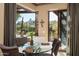 Bright breakfast nook with glass table and scenic views at 27939 N 100Th Pl, Scottsdale, AZ 85262
