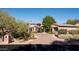 Elegant home with stone facade, landscaped entry, and welcoming porch at 27939 N 100Th Pl, Scottsdale, AZ 85262