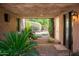Private courtyard with a stone path and lush landscaping at 27939 N 100Th Pl, Scottsdale, AZ 85262
