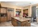 Open kitchen showcasing granite countertops and custom cabinetry at 27939 N 100Th Pl, Scottsdale, AZ 85262