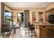 Gourmet kitchen with island, granite countertops, and custom wood cabinetry at 27939 N 100Th Pl, Scottsdale, AZ 85262