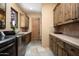 Well-equipped laundry room with ample cabinetry and modern appliances at 27939 N 100Th Pl, Scottsdale, AZ 85262