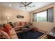 Cozy living room with southwestern decor and a large window at 27939 N 100Th Pl, Scottsdale, AZ 85262