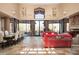 Open floor plan with large windows, fireplace, and stylish seating at 27939 N 100Th Pl, Scottsdale, AZ 85262
