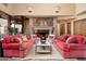 Cozy living space with fireplace and comfortable seating arrangement at 27939 N 100Th Pl, Scottsdale, AZ 85262