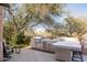 Modern outdoor kitchen with grill, sink, and ample counter space at 27939 N 100Th Pl, Scottsdale, AZ 85262