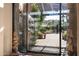 View through glass doors showing a serene patio and mountain views at 27939 N 100Th Pl, Scottsdale, AZ 85262