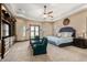 Main bedroom with sitting area and large ceiling fan at 2796 E Meadowview Ct, Gilbert, AZ 85298