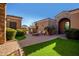 Courtyard with fire pit, seating, and lush lawn at 2796 E Meadowview Ct, Gilbert, AZ 85298