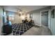 Spacious bonus room with two armchairs and a large TV at 2811 E Dunbar Dr, Phoenix, AZ 85042