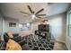 Bonus room with two armchairs, a coffee table and a large TV at 2811 E Dunbar Dr, Phoenix, AZ 85042