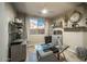 Bright home office features built-in shelving and a large desk at 2811 E Dunbar Dr, Phoenix, AZ 85042