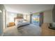 Large main bedroom with a king-size bed and private balcony access at 2811 E Dunbar Dr, Phoenix, AZ 85042