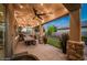 Covered patio with string lights, outdoor furniture, and a dining table at 2811 E Dunbar Dr, Phoenix, AZ 85042
