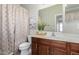 Bathroom with wood vanity, shower, and decorative accents at 2944 E Shady Spring Trl, Phoenix, AZ 85024