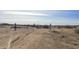 Driveway entrance to property with open gates at 30314 W Wildcat Dr, Wittmann, AZ 85361