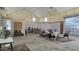 Large open space with furniture and high ceilings at 30314 W Wildcat Dr, Wittmann, AZ 85361