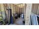 Unfinished storage room with various items at 30314 W Wildcat Dr, Wittmann, AZ 85361