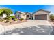 Curved driveway leading to a two-car garage at 3867 W Emma Ct, Florence, AZ 85132