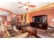 Living room with brown leather sofas and southwestern decor at 3867 W Emma Ct, Florence, AZ 85132