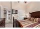 Comfortable bedroom with striped bedding and closet at 42424 N Gavilan Peak Pkwy # 42206, Anthem, AZ 85086