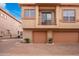 Tan two-story building with attached garage and balcony at 42424 N Gavilan Peak Pkwy # 42206, Anthem, AZ 85086