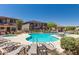 Community pool with lounge chairs and spa at 42424 N Gavilan Peak Pkwy # 42206, Anthem, AZ 85086